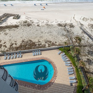 Take a dip in the inviting pool surrounded by sun loungers, with easy access to the beach just steps away