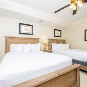 Drift into comfort on the plush queen beds in this guest suite, enveloped by soft linens and tranquil decor