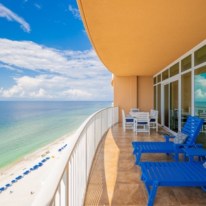 Enjoy expansive views of the tranquil waters and inviting beach below from your spacious balcony