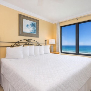 Bask in the inviting vibe of this king master suite with a stunning coastal view through your window