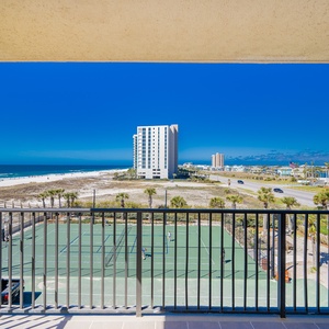 Take in the vibrant views of the beach and tennis courts from your comfortable balcony, perfect for relaxation