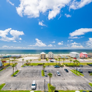The bright space offers stunning beach views, with vibrant blue skies and nearby palm trees enhancing the relaxing atmosphere