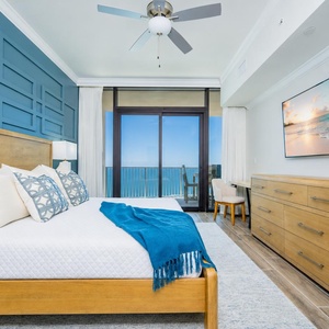 Relax in this master suite featuring a king bed, stylish decor, and beachfront balcony access