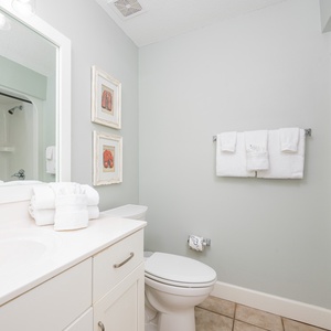 Freshen up in this guest bath in the relaxing shower or soothing tub before an exciting day