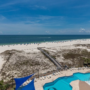 Gaze at the pool area with lounge chairs and umbrellas, perfect for a relaxing day in the sun