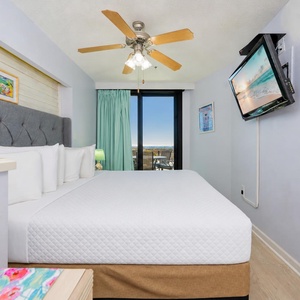 Soft coastal breezes drift in through the sliding door as you drift off in your king suite bed