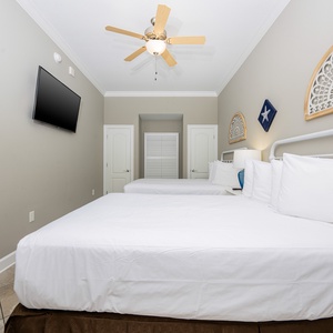 Unwind in this queen guest suite and stream your favorite shows or enjoy a good movie after a beach day