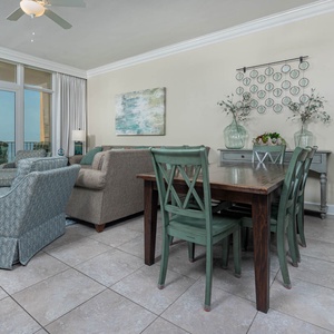 Relax in the inviting living area with comfortable seating and a dining table, perfect for meals and gatherings