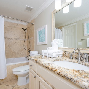 Granite counters complement the guest bath where you refresh after a day exploring the coast