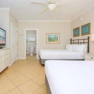 Rest comfortably on plush double beds as you settle in for a cozy movie night with family in the guest suite