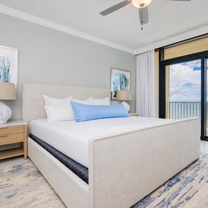 Unwind in this master bedroom featuring a plush king bed with soft linens and stunning beachfront views
