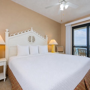 King bed in the master suite invites restful sleep after listening to waves from your balcony beside the coast