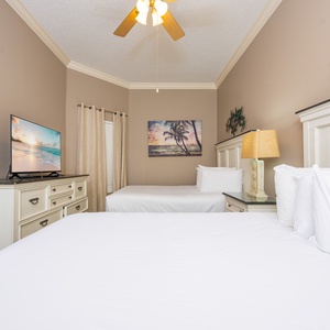 Rest in the cozy queen beds in this guest room, enjoy entertainment and recharge for beach adventures ahead