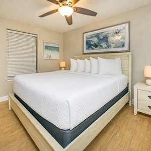 Feel the comfort of plush king bedding while enjoying your favorite shows in this guest bedroom