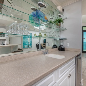 Craft drinks and snacks at the stylish wet bar while enjoying the coastal vibe just steps from your balcony