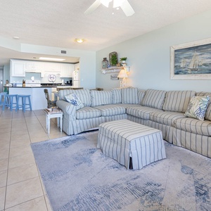Relax in the spacious living area with a sofa with queen sleeper and easy access to the kitchen for delightful meals