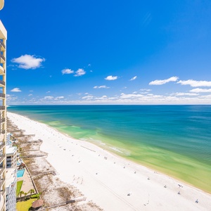 Relax on your balcony, enjoying stunning views of the beach and the gentle rhythm of the waves below