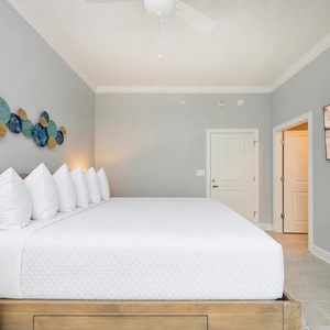 Unwind in this serene king guest room with your favorite show after a day of adventure