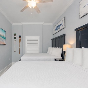 Unwind after a day at the beach in this guest room with two cozy queen beds and stream your favorite show