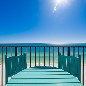 Relax on your balcony with a gentle breeze and the rhythmic sound of waves meeting the shore