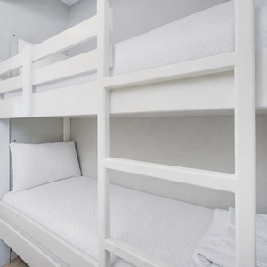 Bunk beds in the hallway offer a cozy spot for the kids after fun-filled days along the coast