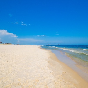 Soak up the sun in the soft sand with beach chairs and umbrellas, just steps from the beautiful shoreline and inviting waters