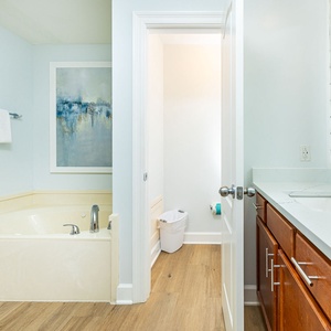 Indulge in relaxation in the master bath with a refreshing walk-in shower and soothing jetted tub