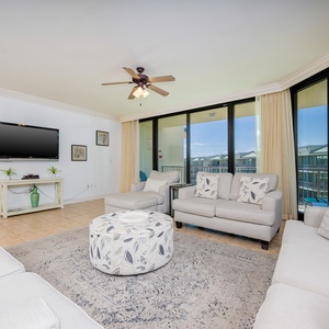 Unwind in the inviting living area, enjoying your favorite shows while soaking in the coastal views
