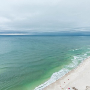 Experience seemingly endless coastline views of the horizon as waves lap the shore and the sun glistens over the water