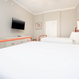 Relax on one of the cozy queen beds in this guest suite with a good movie and enjoy a peaceful slumber