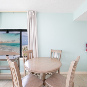 Enjoy meals at the round dining table while taking in the stunning views through the large sliding glass doors