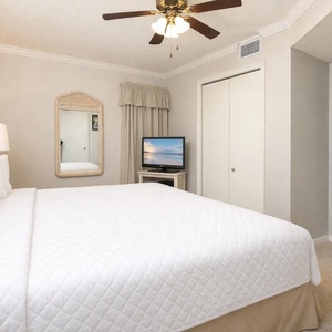 Cozy up in the king suite as you enjoy your favorite shows on the TV, surrounded by beach decor