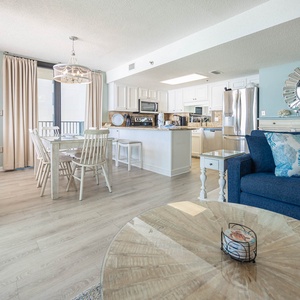 Dine at the charming table or relax on the cozy couch, enjoying the open layout and inviting decor throughout