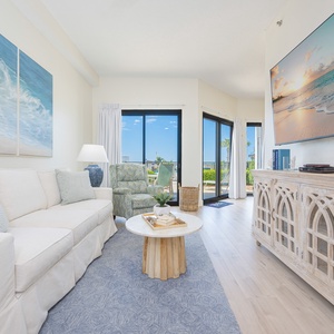 Unwind on the cozy sofa with queen sleeper surrounded by stunning views from the outdoor patio area