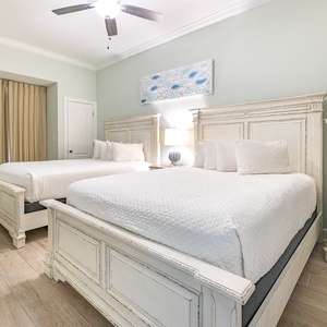 Relax on one of the cozy queen beds in this guest suite and enjoy a peaceful slumber