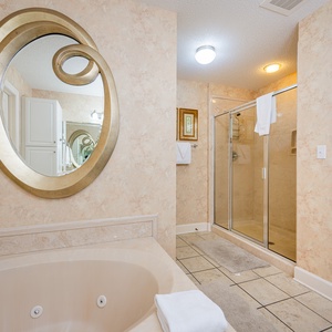 Indulge in relaxation in the master bath with a refreshing walk-in shower and soothing jetted tub