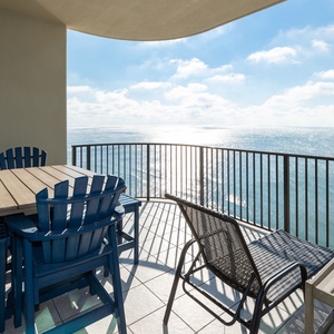 Savor the coastal views while lounging with loved ones at your balcony table, perfect for evening chats
