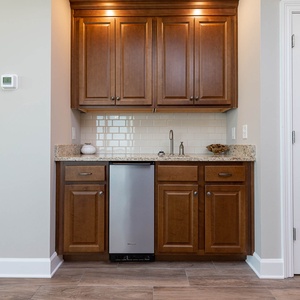 Mix refreshing drinks at the sleek wet bar, perfect for enjoying during your beach getaway