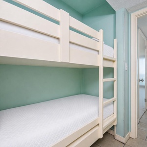 Bunk beds in the sleeping area offer a cozy spot for the kids after fun-filled days along the coast
