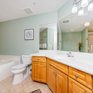 Indulge in relaxation in the master bath with a refreshing walk-in shower and soothing jetted tub