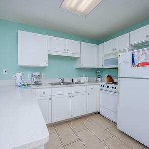 Discover a hotel kitchen that transforms your beach retreat into ultimate convenience, just like home