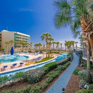 Immerse yourself in relaxation by the pool, surrounded by swaying palms and the gentle sounds of the bay