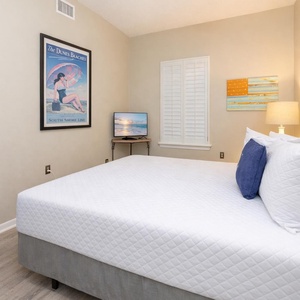 Cozy up in this queen guest suite while streaming your favorite shows in this inviting bedroom retreat