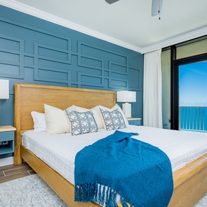 Relax in this serene master bedroom featuring a king bed overlooking the beach and sleeping to the sound of the waves