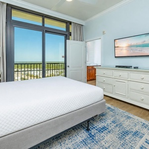 Relax on the cozy queen bed in this guest suite and stream your favorite shows after a beach day