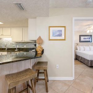 Granite countertops reflect kitchen activity as you prepare snacks before relaxing in the master suite with a king bed