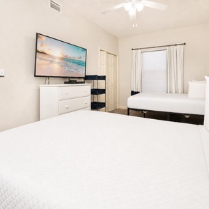 Two plush double beds in the guest suite promise restful sleep before your next day of beachside fun