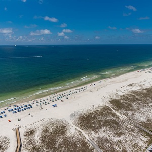 Gaze at the sweeping coastline while enjoying the refreshing breeze from your spacious balcony retreat