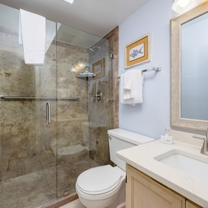 The master bath features a spacious walk-in shower, elegant fixtures, and a light color palette for a refreshing experience