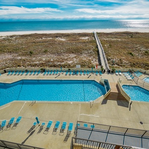 Splash and relax by the inviting pool, soaking in the sun and coastal vibes with loved ones nearby